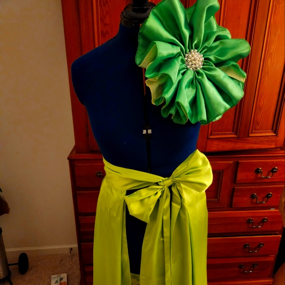 Shades of green drape wrap and large flower pin
